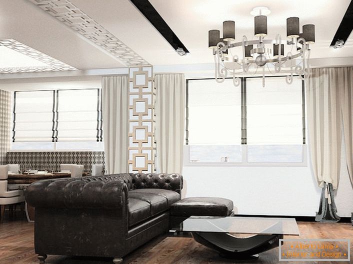 Mobilierul în stilul artei deco este întotdeauna mobilier de dimensiuni mari. Ideal pentru decorarea livingului în acest concept stilistic este o canapea din piele cu tapițerie matlasată.