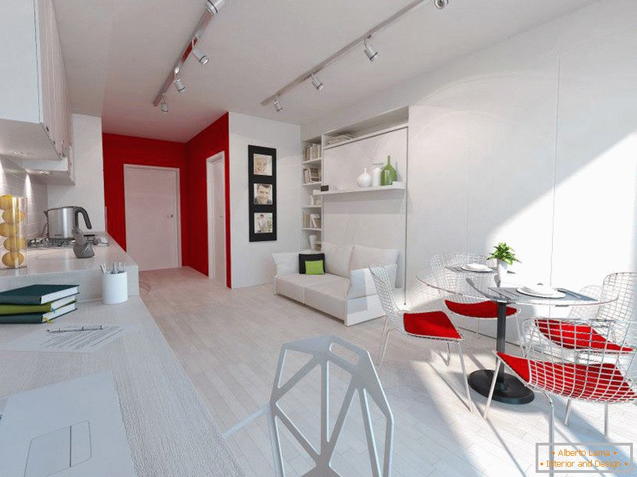 Interiorul alb al unui apartament mic cu accente roșii