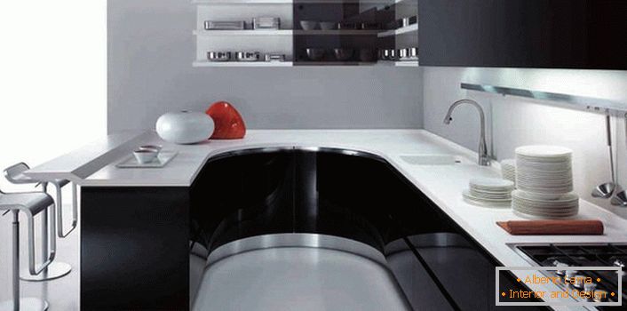 Confortabil în bucătăria sa funcțională în stilul high-tech. Găsiți proiectantul contorului de bare ca o continuare a zonei de lucru.