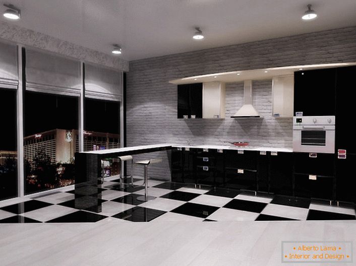 Bucătăria în stilul minimalismului în apartamentul studio cu ferestre panoramice este o alegere excelentă pentru cei care iubesc spațiul și libertatea de acțiune.