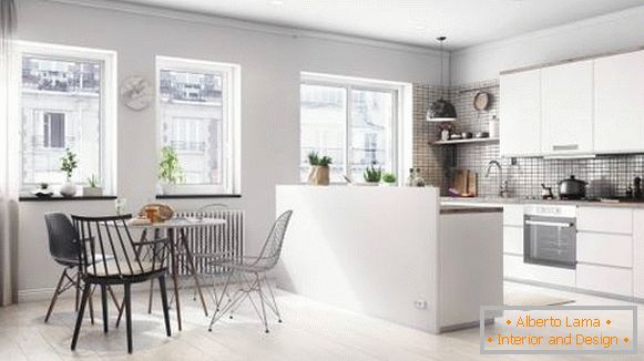Bucătărie și zonă de luat masa în apartamentul studioului scandinav